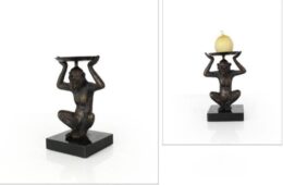 Monkey Holding Candle Overhead